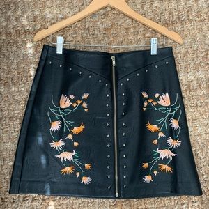 Leather skirt with embroidered detail.